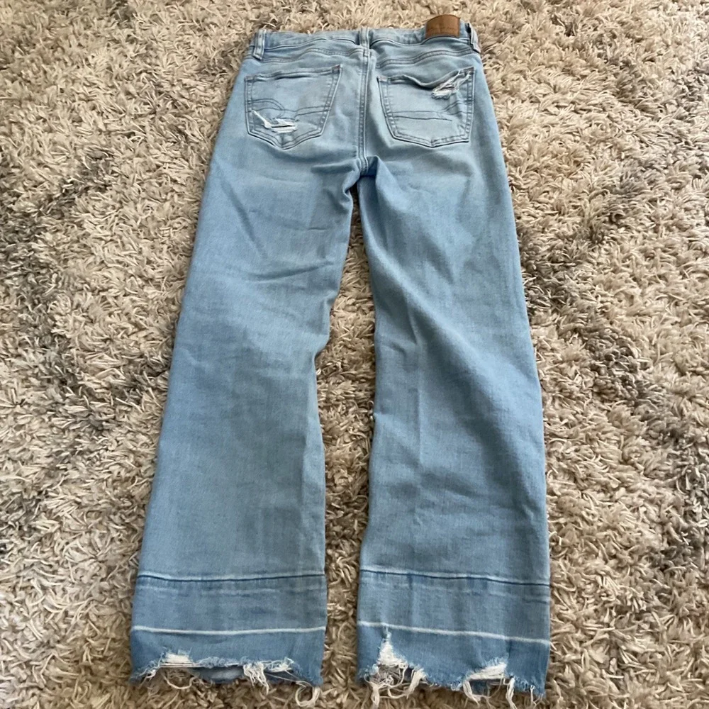 American Eagle Light Wash High Rise Flare Jeans Raw Released Hem Size 00 Regular